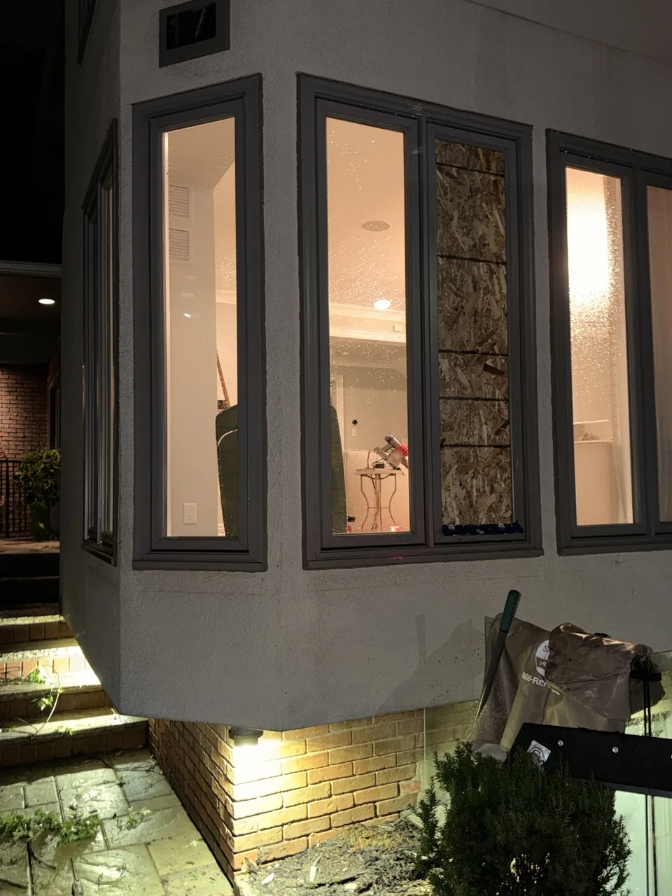 Exterior view of temporary board-up in the storm-damaged Toronto window
