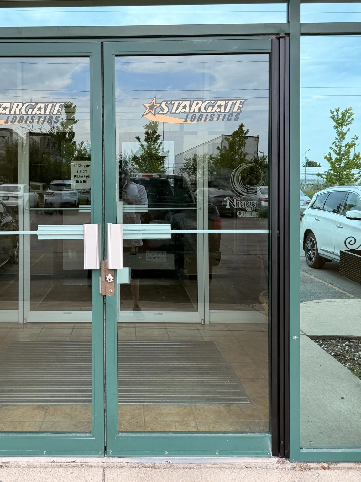 First Mississauga entrance after installation of a full-height continuous geared hinge