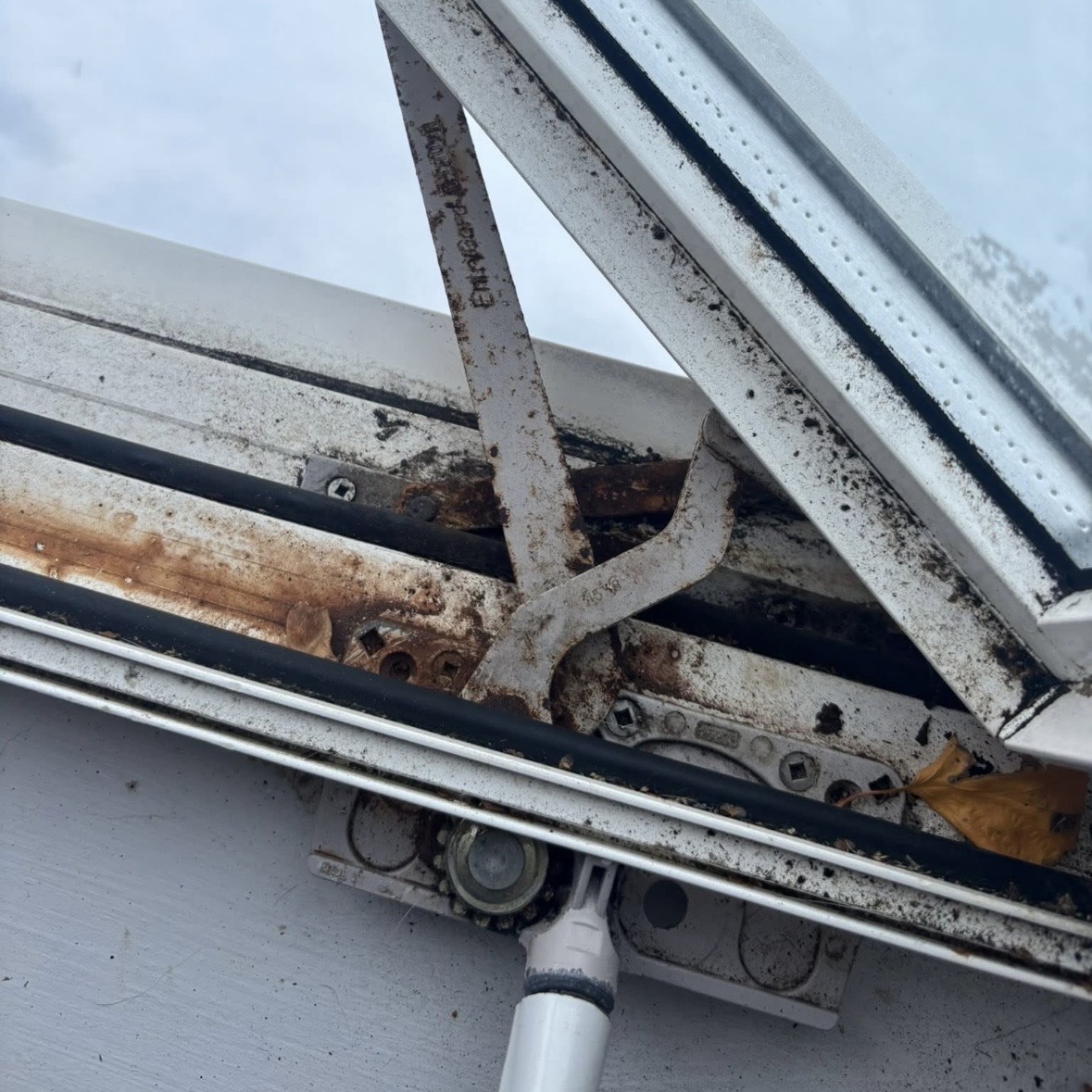 Rusted awning window operator arms and seized linkage