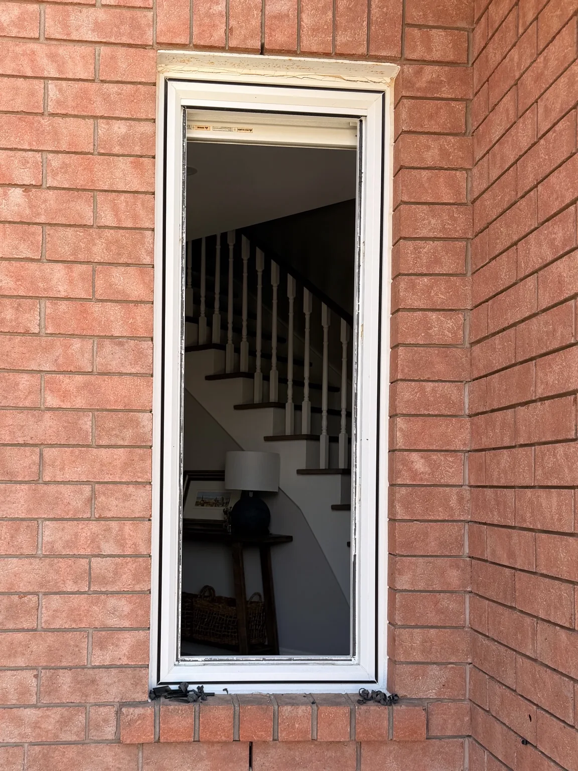 Tall Bolton residential window opening before insulated glass unit replacement